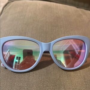 Goodr light blue sunglasses with pink polarized lenses